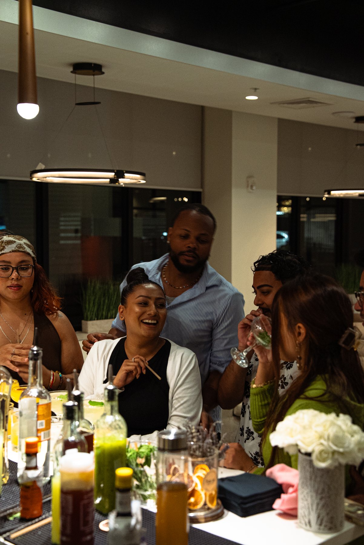 Guests enjoying cocktails around the mobile bar