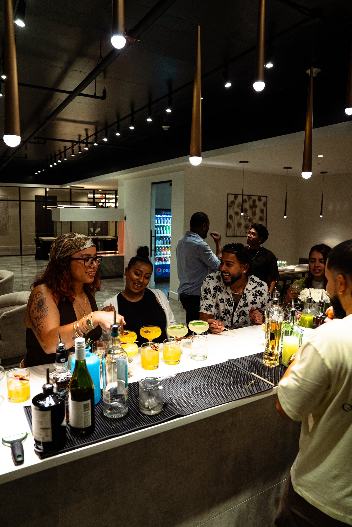 Private event bar setup with guests and cocktails