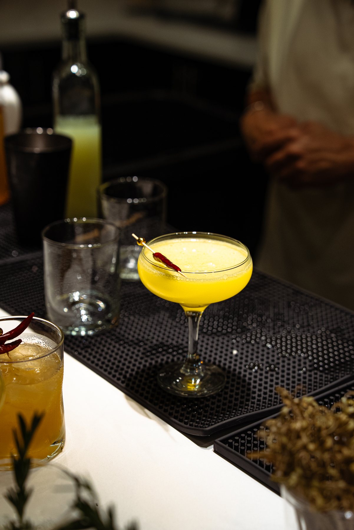 Yellow coupe cocktail on the bar