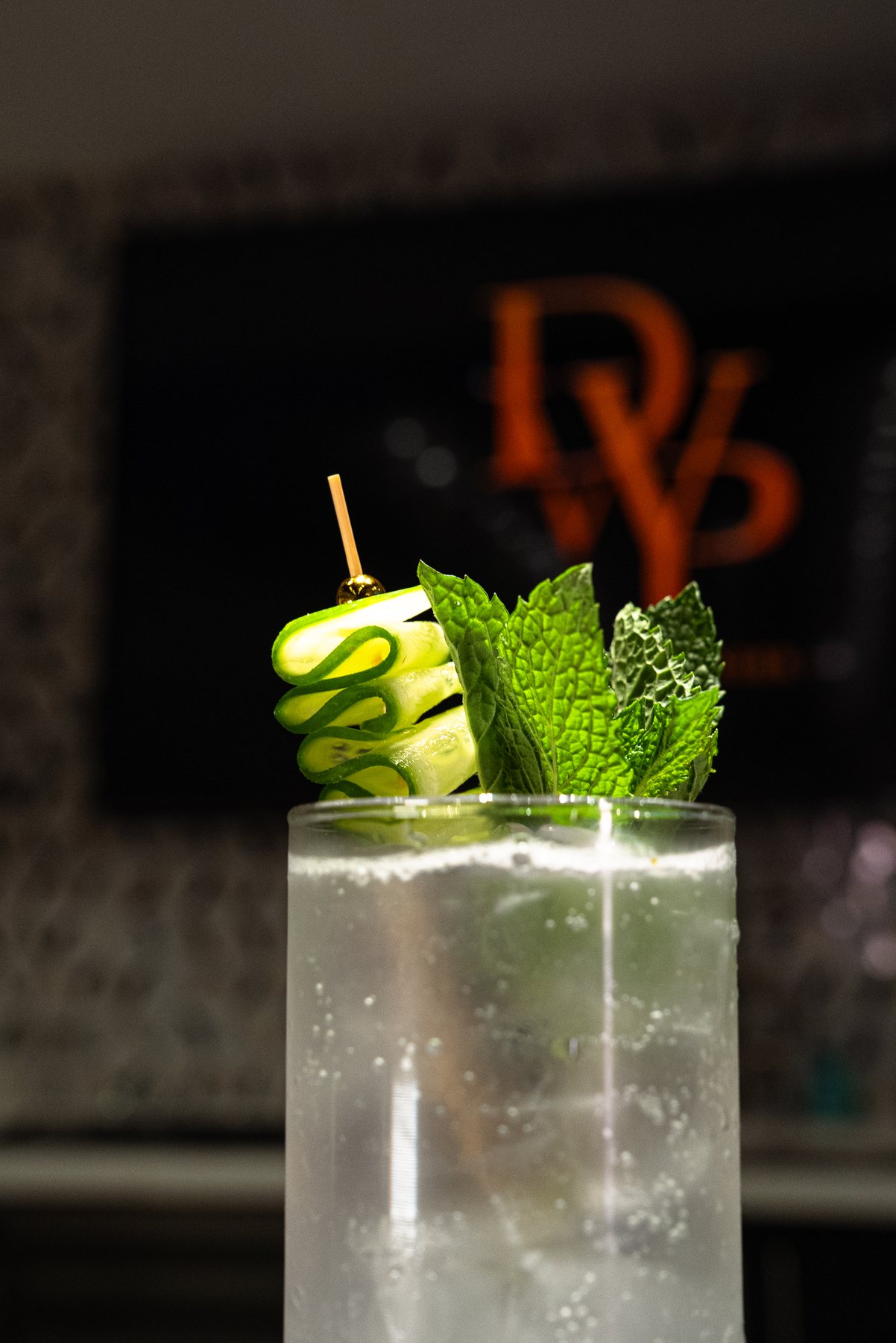 Cucumber mint cocktail with Drinkswitpapiii branding